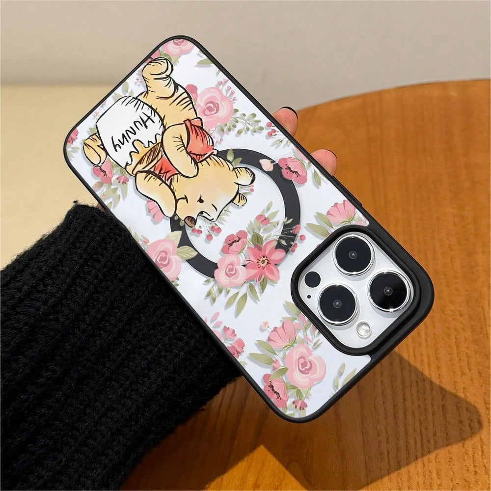 Disney.‌ Disney Winnie The Pooh Floral Patterned Phone Case Featuring A Cute Bear Enjoying Honey. Compatible With IPhone 17, 16, 15, 14, 13, 12, And 11 Pro Models. Made Of TPU With Shockproof Protecti