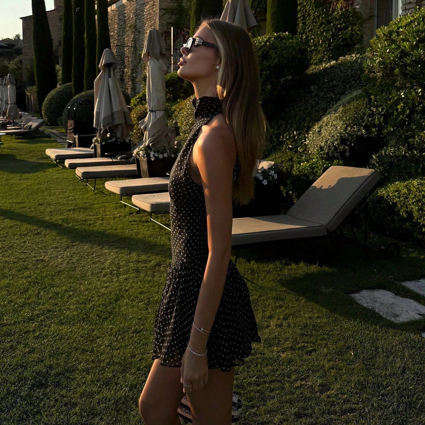 Sleeveless High Neck Polka Dot Mini Dress, Ruffle Hem, A-Line Silhouette Elegant Summer Party Black