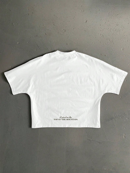 StoneGrade White Summer Streetwear Vacation Retro American Outdoor Landscape Graphic English Slogan Cropped Loose Fit Bat Wing Short Sleeve T-Shirt For Men
