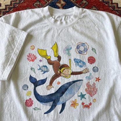 Women's Curious George Holiday Diving Print T-Shirt, Childhood Fun Style, 100% Cotton, Cute Age-Defying Cartoon Top, Daily Wear, Holiday Gift